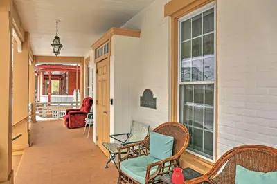 a porch with wicker chairs and a window at Saratoga Springs Apt - Walk to Town and Race Track! in Saratoga Springs