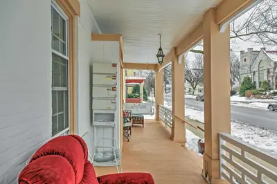 a porch of a house with a red blanket at Saratoga Springs Apt - Walk to Town and Race Track! in Saratoga Springs