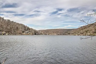a view of a lake with mountains in the background at Dainty New Preston Cottage with Dock and Lake Views! in New Preston