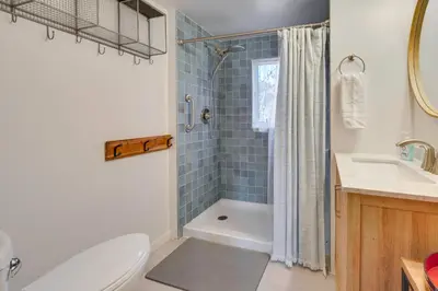 a bathroom with a tub and a toilet and a sink at By Mtn Creek Resort The Point on Highland Lake in Highland Lakes