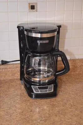a black coffee pot sitting on a counter at La Casita Bonita Near NYC in Yonkers