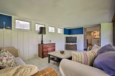 a living room with a couch and a tv at Charming Tivoli Home with Patio, by Town and Shops in Tivoli