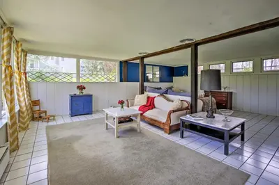 a living room with a couch and a table at Charming Tivoli Home with Patio, by Town and Shops in Tivoli