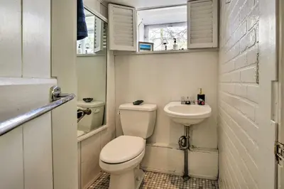 a small bathroom with a toilet and a sink at Charming Tivoli Home with Patio, by Town and Shops in Tivoli