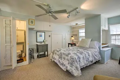 a bedroom with a bed and a ceiling fan at Charming Tivoli Home with Patio, by Town and Shops in Tivoli