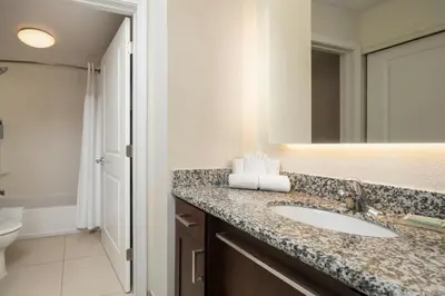 a bathroom with a sink and a toilet at Residence Inn by Marriott Springfield Chicopee in Chicopee