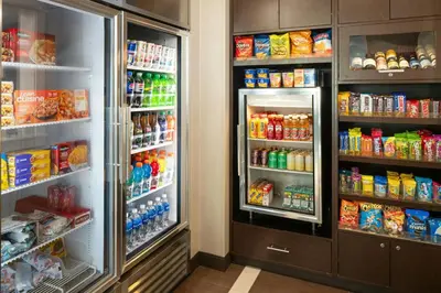 a refrigerator filled with lots of food and drinks at Residence Inn by Marriott Springfield Chicopee in Chicopee