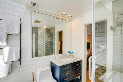 a bathroom with a sink and a shower at Wilmington Retreat with Deck, Lake Views and Game Room in Wilmington