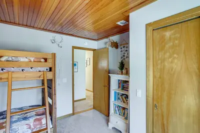 a room with a wooden ceiling and a closet at Wilmington Retreat with Deck, Lake Views and Game Room in Wilmington