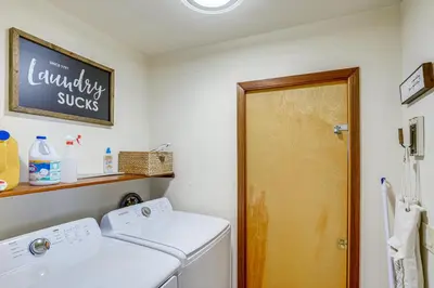 a laundry room with a washer and dryer at Wilmington Retreat with Deck, Lake Views and Game Room in Wilmington