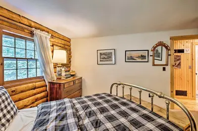 a bedroom with a bed and a window at Private Wooded Cabin 7 Mi to Mount Snow! in Wilmington