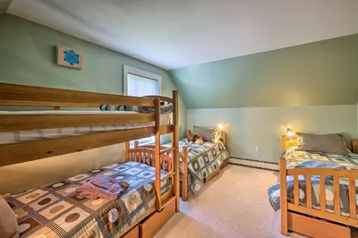 two bunk beds in a room with green walls at West Dover Home with Deck, Grill and EV Outlet in West Dover