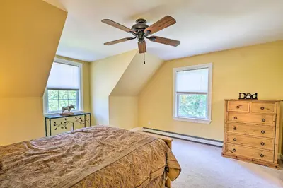 a bedroom with a ceiling fan and a dresser at West Dover Home with Deck, Grill and EV Outlet in West Dover