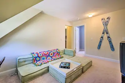 a living room with a couch and a statue at West Dover Home with Deck, Grill and EV Outlet in West Dover