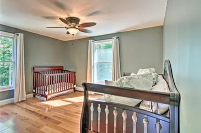 a bedroom with a crib and a ceiling fan at West Dover Home - 3 Miles to Mount Snow Resort! in West Dover