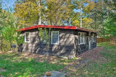 a small cabin in the middle of the woods at Catskill Mtn Home with Deck about 1 Miles to Zoom Flume! in East Durham