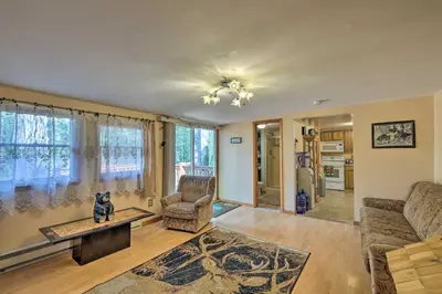 a living room with a couch and a table at Catskill Mtn Home with Deck about 1 Miles to Zoom Flume! in East Durham