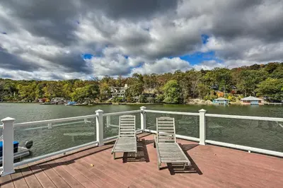 two chairs sitting on the deck of a boat at Lake Hopatcong Family Home with Boat Slip and Dock in Hopatcong
