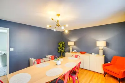 a dining room with a table and chairs at Walk to Dining Downtown Lenox Guest House! in Lenox