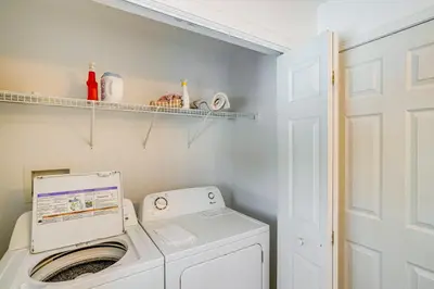 a laundry room with a washer and dryer at Walk to Dining Downtown Lenox Guest House! in Lenox