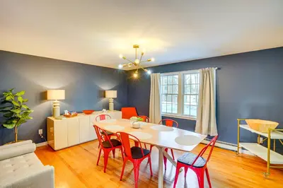 a living room with a dining room table and chairs at Walk to Dining Downtown Lenox Guest House! in Lenox
