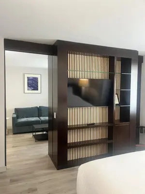 a living room with a tv and a couch at Four Points by Sheraton New York Downtown in New York