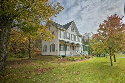 a large white house on a yard with trees at Catskills House 1 Mi to Windham Mountain Resort! in Windham