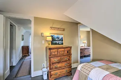 a bedroom with a bed and a dresser at Catskills House 1 Mi to Windham Mountain Resort! in Windham