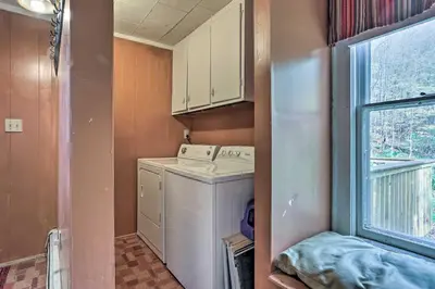 a laundry room with a washing machine and a window at Catskills House 1 Mi to Windham Mountain Resort! in Windham