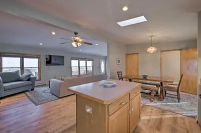 a living room with a couch and a table at Catskills Mtn Retreat with Panoramic View and Fire Pit in Cornwallville