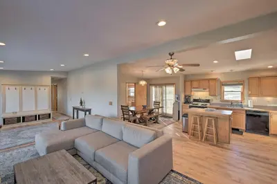 a living room with a couch and a kitchen at Catskills Mtn Retreat with Panoramic View and Fire Pit in Cornwallville