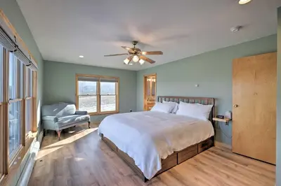 a bedroom with a bed and a ceiling fan at Catskills Mtn Retreat with Panoramic View and Fire Pit in Cornwallville