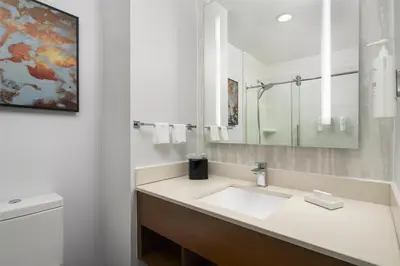 a bathroom with a sink and a toilet at Hilton Garden Inn New York/Midtown Park Avenue in New York