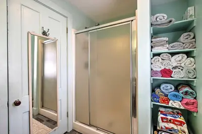 a walk in shower in a bathroom with towels at Historic Huntington Home - Walk to Westfield River in Huntington