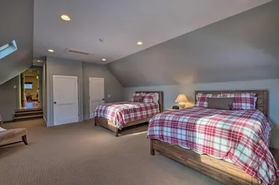 a bedroom with two beds in a room at Luxe Green Barn Near Skiing with Mt Equinox Views! in Manchester Center
