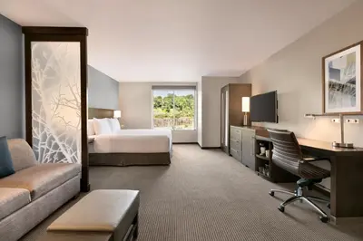 a hotel room with a bed and a desk at Hyatt Place Fort Lee/George Washington Bridge in Fort Lee