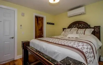 a bedroom with a large bed in a room at Cold Spring Hotel in Cold Spring