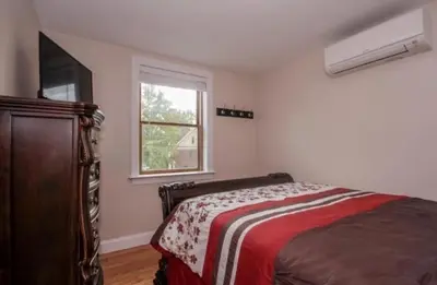 a bedroom with a bed and a window at Cold Spring Hotel in Cold Spring