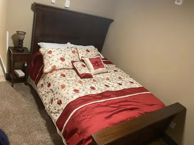 a bed with pillows on it in a bedroom at Cold Spring Hotel in Cold Spring