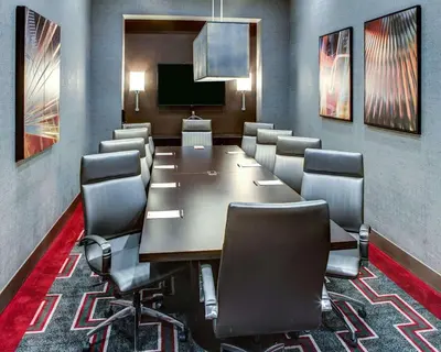 a conference room with a long table and chairs at Cambria Hotel White Plains - Downtown in White Plains