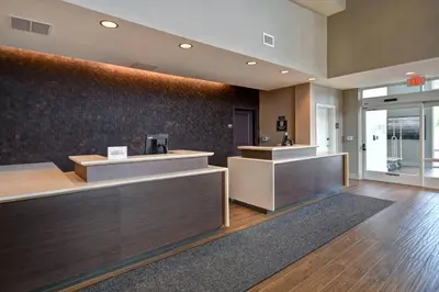 a lobby with reception desks in a building at Residence Inn Middletown Goshen in Middletown