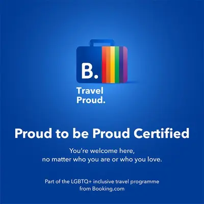 a sign that says proud to be proud certified with a suitcase at Morris Guest House in Bronx