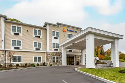 a rendering of a hotel with a building at Comfort Inn Brewster in Brewster