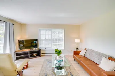 a living room with a couch and a tv at Cozy Catskill Condo - 2 Mi to Windham Mountain Ski in Windham