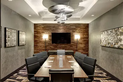 a conference room with a long wooden table and chairs at Hampton Inn Brooklyn Downtown in Brooklyn