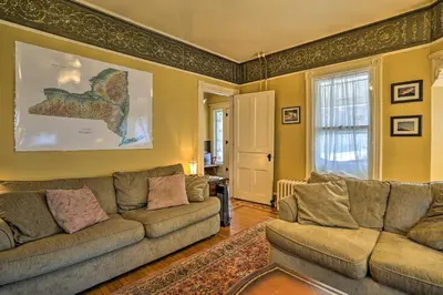 a living room with two couches and a window at Historic House with Record Player, Walk to Downtown! in Roxbury