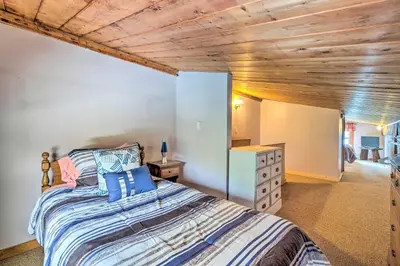 a bedroom with a bed and a wooden ceiling at Woodsy Wilmington Condo 7 Mi to Mount Snow! in Wilmington