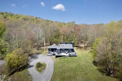 an aerial view of a house in the woods at The Mountain House Windham Retreat with Hot Tub! in Windham