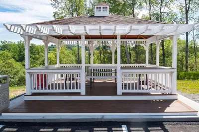 a white gazebo with a roof at Microtel Inn & Suites by Wyndham Amsterdam NY in Amsterdam