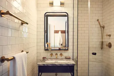a bathroom with a sink and a mirror at The Hoxton, Williamsburg in Brooklyn